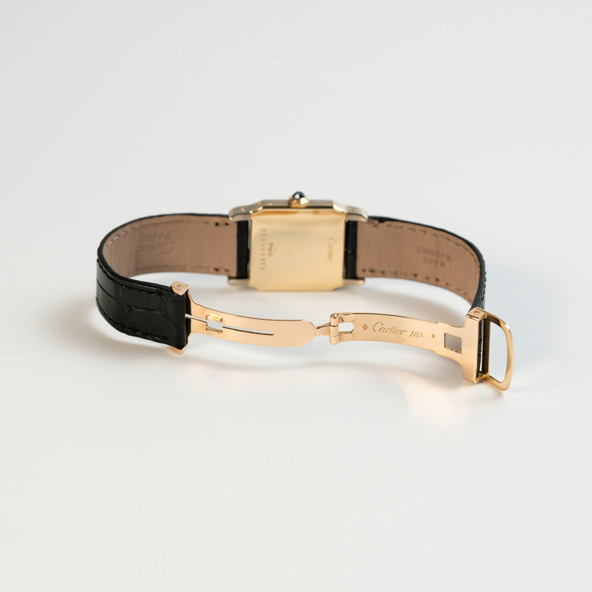 Geöffnete Faltschließe der Cartier Santos Dumont "Deux Ors" mit Paris Dial am schwarzen Lederarmband