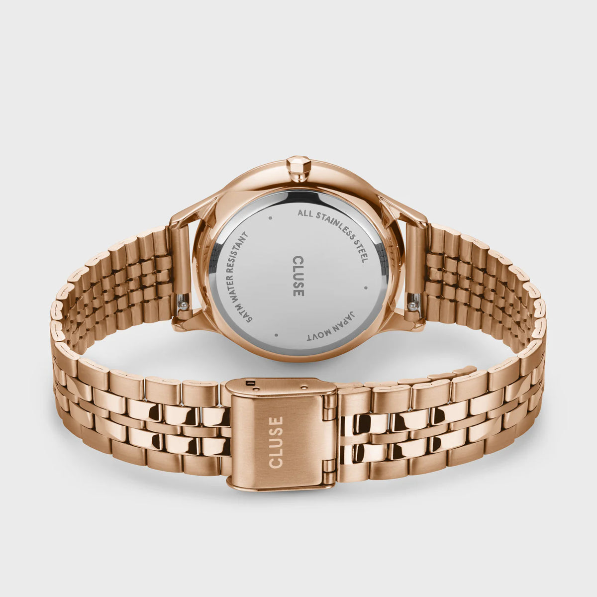 Blick auf das Armband der Cluse Stahl-Uhr "Minuit Multifunction" im Rosègold-Look mit weißem Zifferblatt und drei Sub-Dials zur Wochentags-, Datums-Anzeige und 24 Stunden-Zähler