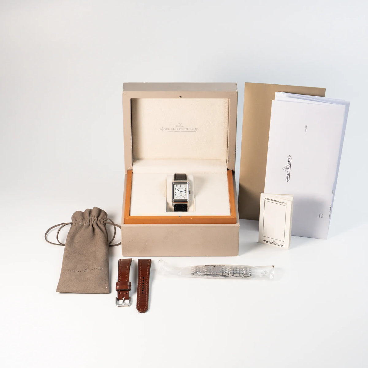 Jaeger LeCoultre Reverso Duoface 270.8.54 in Stahl zusammen mit dem Lieferumfang, betsehend aus Box, Paapieren  und zusätzlichen Stahlband , sowie einem braunen Lederband